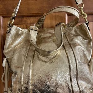 Coach purse metallic gold in perfect condition inside & outside! 2 handles